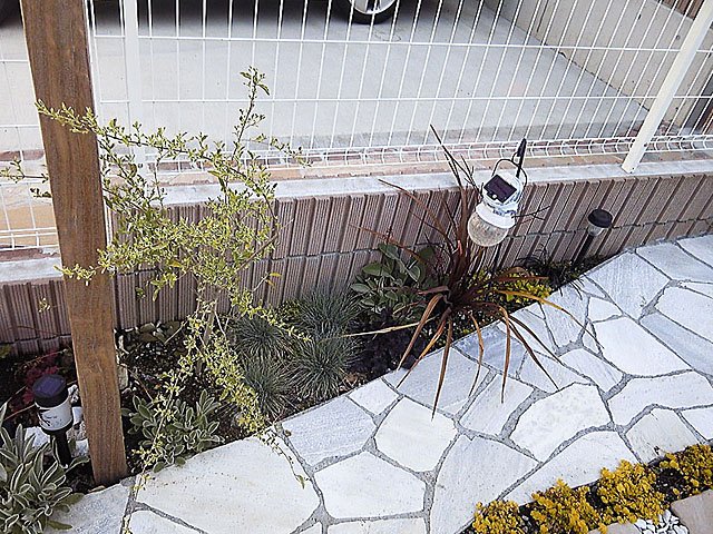 Exterior and Entrance Approach with Stone and Tile