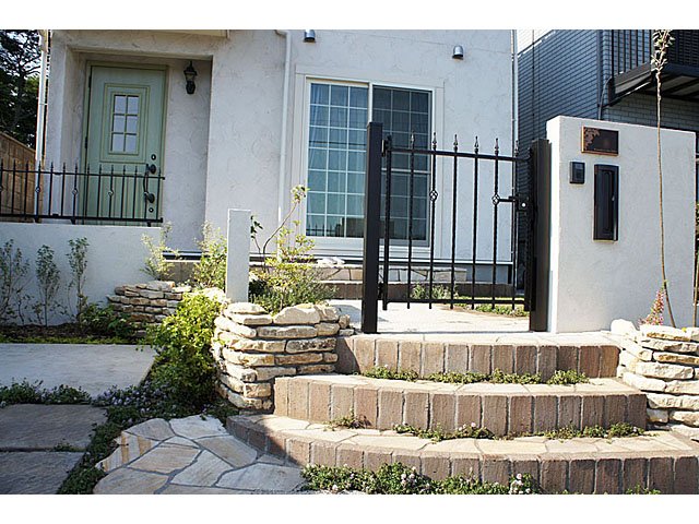 Country Exterior with Masonry at Stone Approach