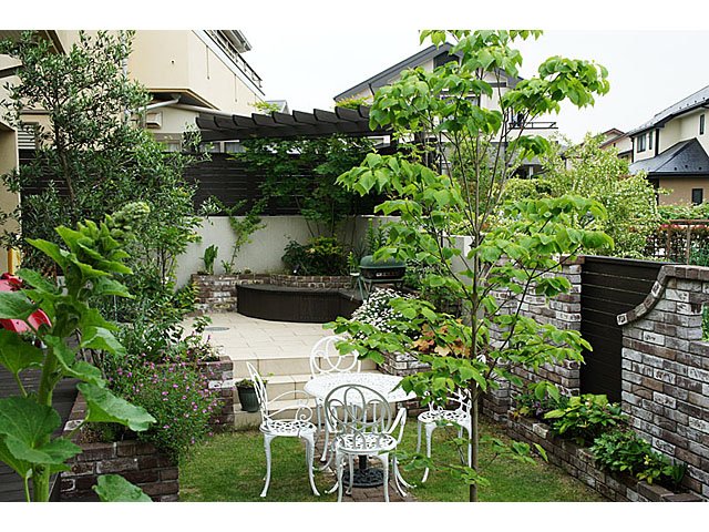 Garden of Brick Flowerbed and Tile Terrace